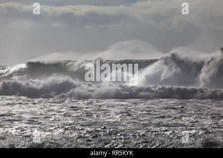 Strong wind blows spray from the top of big waves approaching windansea beach in La Jolla, San Diego, California, USA Stock Photo