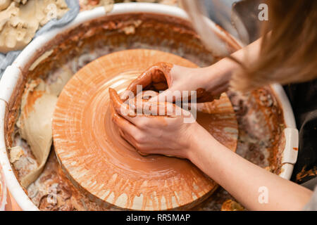 Artisan potter prepares material clay for pottery. Man knead clay before  molding. Male sculptor is pugging and kneading clay for creating ceramics  in Stock Photo - Alamy