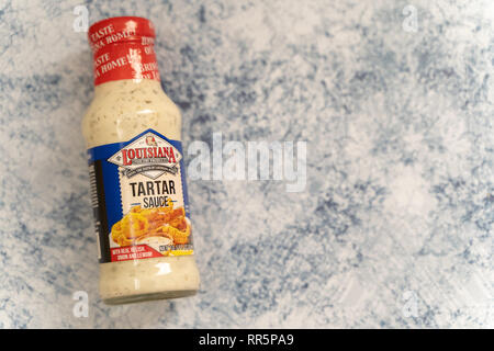 Feb 24, 2019 - Maple Grove, MN: Louisiana Fish Fry Products brand Tartar Sauce, isolated on blue marble. Useful for dipping with fish Stock Photo