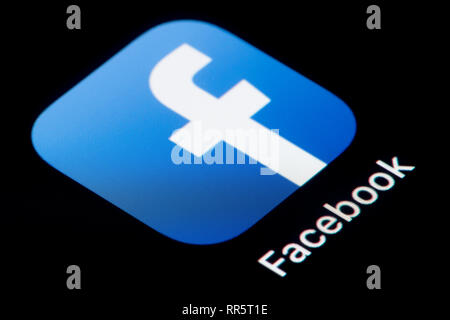 A close-up shot of the Facebook app icon, as seen on the screen of a smart phone (Editorial use only) Stock Photo