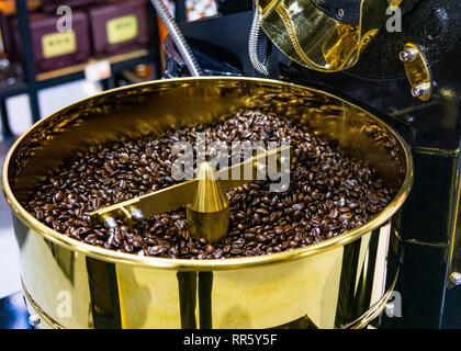 Roasted coffee in coffee roaster, arabica roasted coffee crop Stock Photo