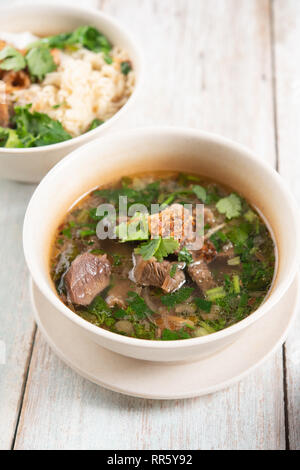 Asian bone soup or sup tulang, popular traditional malay dish. Stock Photo