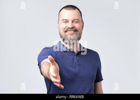 Positive human emotions, facial expressions, feelings. Friendlymature european man saying h Stock Photo