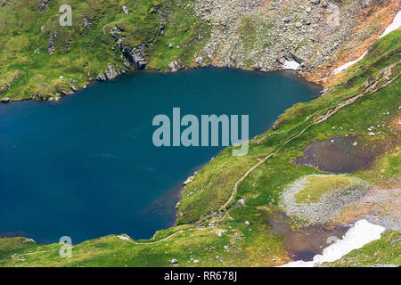 summer time in romanian carpathians. beautiful scenery of fagaras mountains. lake capra view from above Stock Photo