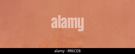 Stucco painted wall texture background, orange color, italian style, banner Stock Photo