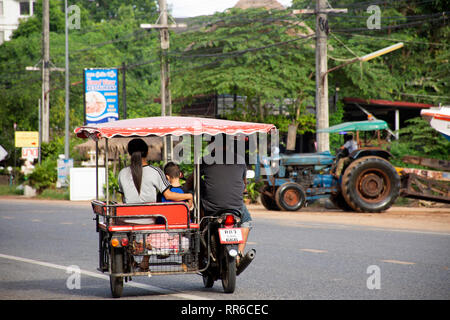 Thai people riding and driving on the road at Ban Phe village city on July 4, 2018 in Rayong, Thailand Stock Photo