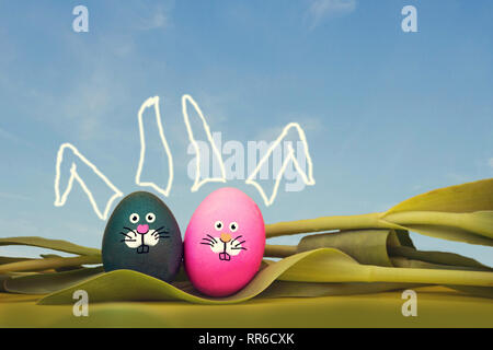 painted Easter eggs with bunny face and blue sky, lying in tulips, easter spring concept Stock Photo
