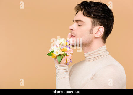 side view of tender man with alstroemeria flowers on hand touching