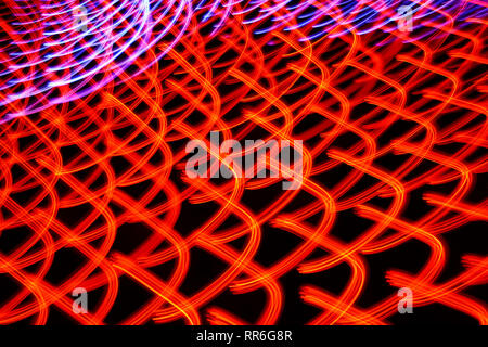 Long exposure photo of moving colorful neon light patterns Stock Photo