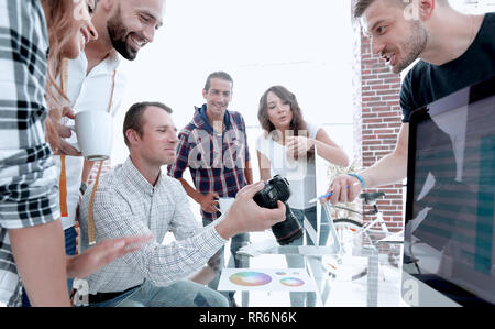 group photo of editors working in a modern office. Stock Photo