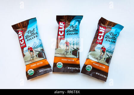 ST. PAUL, MN/USA - FEBRUARY 24, 2019: Clif Bar peanut butter energy bar grouping of three and trademark logo. Clif Bar & Company is an American compan Stock Photo