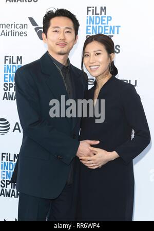 Steven Yeun and Joana Pak arrive at the Film Independent Spirit Awards in a tent in Santa Monica, Los Angeles, USA, on 23 February 2019. | usage worldwide Stock Photo