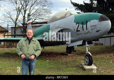 14 February 2019, Bosnia and Herzegovina, Banja Luka: Zlatan Crnalic, former Bosnian Serb fighter pilot and retired colonel, is standing at the airport. Crnalic survived an air battle with American F16 jets over Bosnia on 28 February 1994 - it was the first Nato campaign in its history. Four Serbian planes had been shot down, three Serbian pilots had died. Crnalic was able to fly his Jastreb fighter bomber back to Udbina airport in the then Serb occupied part of Croatia, although an American rocket had severely damaged his aircraft. Crnalic stands in front of a Lockheed T-33 'Shooting Star', t Stock Photo