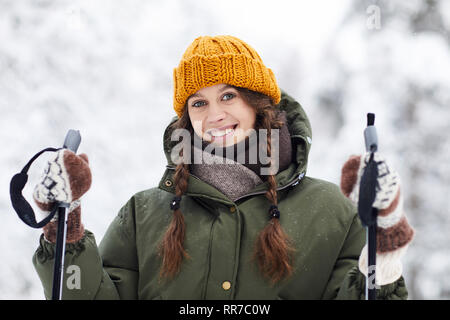 Young Woman Skiing in Forest Stock Photo