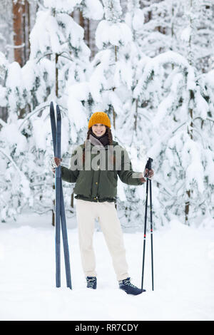 Active Young Woman Skiing Stock Photo