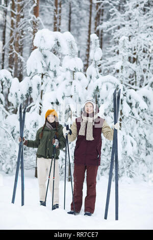 Sportive Couple Skiing in Winter Stock Photo