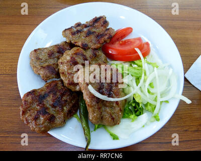 Turkish kofte meatballs with salad. Stock Photo