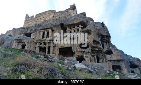 Ancient rock tombs of Tlos ancient city in Turkey. Stock Photo