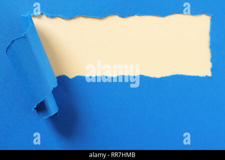 Torn blue paper strip yellow background frame Stock Photo