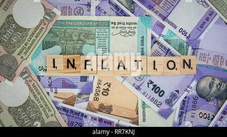 Concept of Inflation word on Indian currency Notes Stock Photo