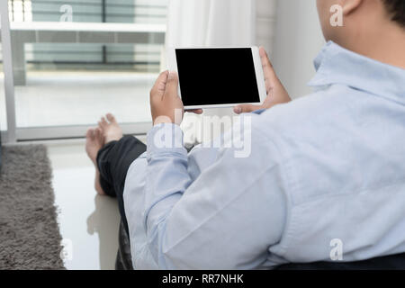 Man hand holding the black smartphone screen mockup Stock Photo