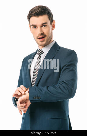 surprised businessman checking time with wristwatch isolated on white Stock Photo