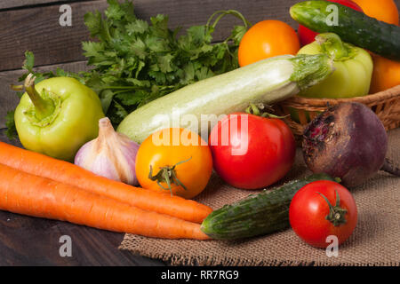 harvest of vegetables on a wooden background Stock Photo