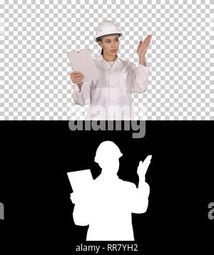 On Alpha Matte. Medium shot. Young Female Scientist Making Video Call With Tablet, Alpha Channel. Professional shot in 4K resolution. 013. You can use Stock Photo