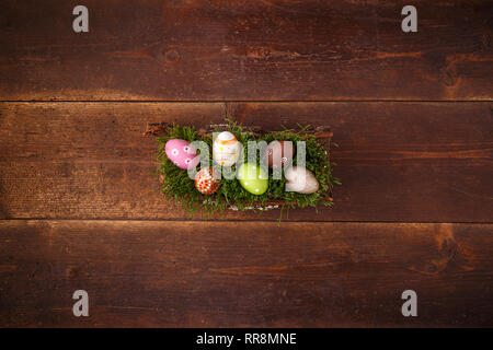 Easter eggs lying on green spring grass, space for your text Stock Photo