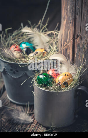 Closeup of Easter eggs in old metal cup Stock Photo