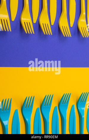 Colorful set of plastic tableware isolated on background Stock Photo