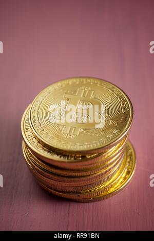 Bitcoins on a wood table. Stock Photo
