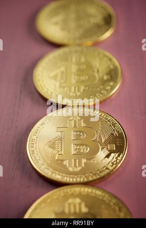 Bitcoins on a wood table. Stock Photo