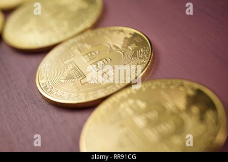 Bitcoins on a wood table. Stock Photo