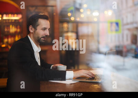 Businessman Enjoying Coffee Break Stock Photo