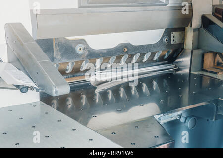 Large electronic knife for cutting paper in the printing Stock Photo