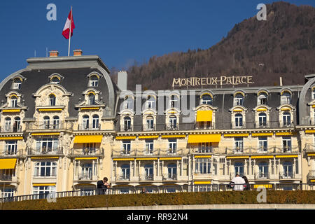 Montreux, Switzerland - 02 17, 2019: Montreux Palace Hotel, a five star luxury hotel with mountains in the background. Stock Photo