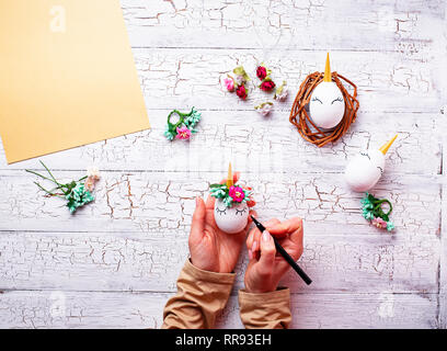 Eggs in shape of unicorn. Step by step. Stock Photo