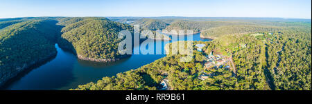 Aerial view of Nepean Lake and forested hills with clear blue sky ...