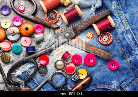 Threads and sewing accessories.Sewing threads, fabric and buttons Stock Photo