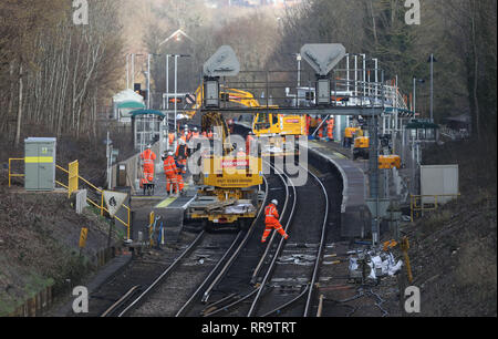 Railway engineers working at Wivelsfield Station at the Southern end of the Brighton Main Line. The improvement works on the Brighton Main Line are a key part of a £300 million government-funded programme to tackle delay hotspots and boost the reliability of the railway in the south east, including the expanded Thameslink network. The Brighton Main Line is a key rail route, connecting Gatwick Airport and the south coast with London, and is used by 300,000 people each day. 20 February 2019 Stock Photo