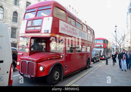 vintage routemaster bus still operating in london england on the no 15 bus route with an updated version behind it Stock Photo