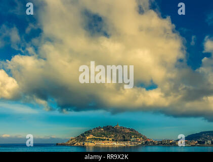 Dramatic clouds above San Sebastian, Spain in the late afternoon Stock Photo