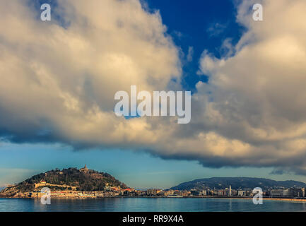 Dramatic clouds above San Sebastian, Spain in the late afternoon Stock Photo