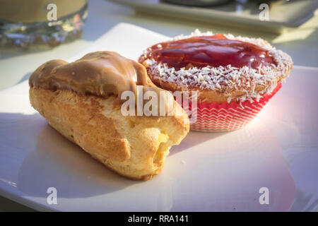 Typical sweet and dessert of Spain, strawberry cake and cream bun. Food Stock Photo