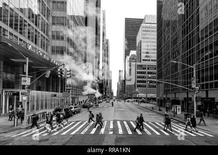 Shot of people crossing the road at 42 St and 6th Avenue, New York, taken from an open top bus. Stock Photo