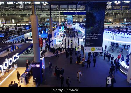 Barcelona, Spain. 25th Feb, 2019. People are seen at the venue of the 2019 Mobile World Congress (MWC) in Barcelona, Spain, Feb. 25, 2019. The four-day 2019 MWC opened on Monday in Barcelona. Credit: Guo Qiuda/Xinhua/Alamy Live News Stock Photo