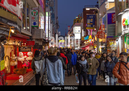 TOKYO, JAPAN - FEBRUARY 1, 2019:  Unidentified people walk along Takeshita street in Harajuku, a famous Japanese cosplay fashion street Stock Photo