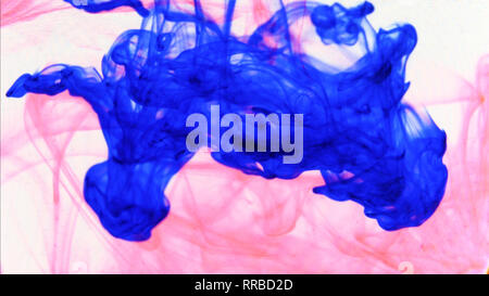 red and blue ink that enters the water forming animated textures, footage ideal for motiongraphic and compositing Stock Photo