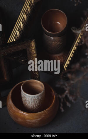Side view on ceramic cups  and bowls looking like a painting in picture frames Stock Photo